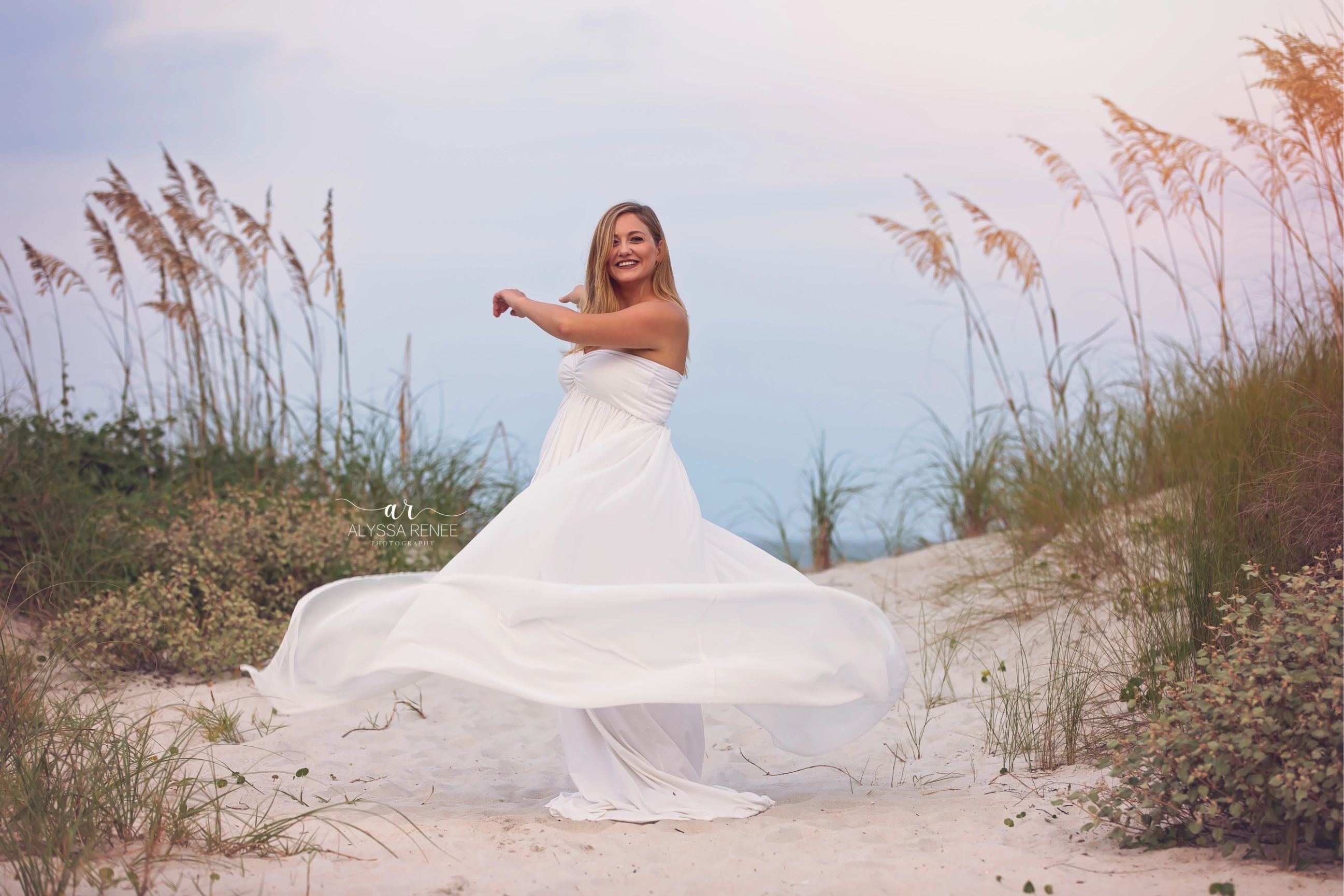 Maternity photos beach twirl white dress by Alyssa Renee Photography