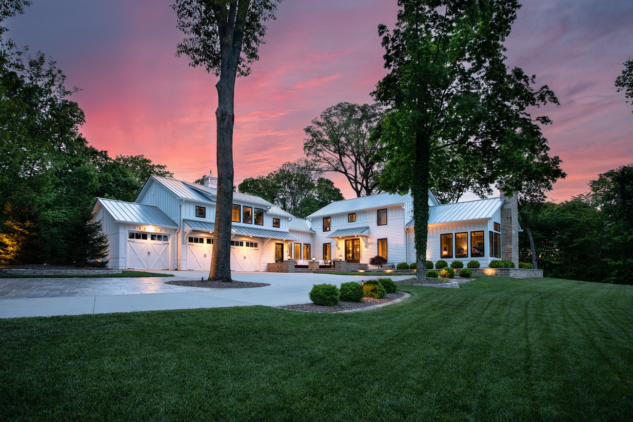 Modern house at sunset with large trees