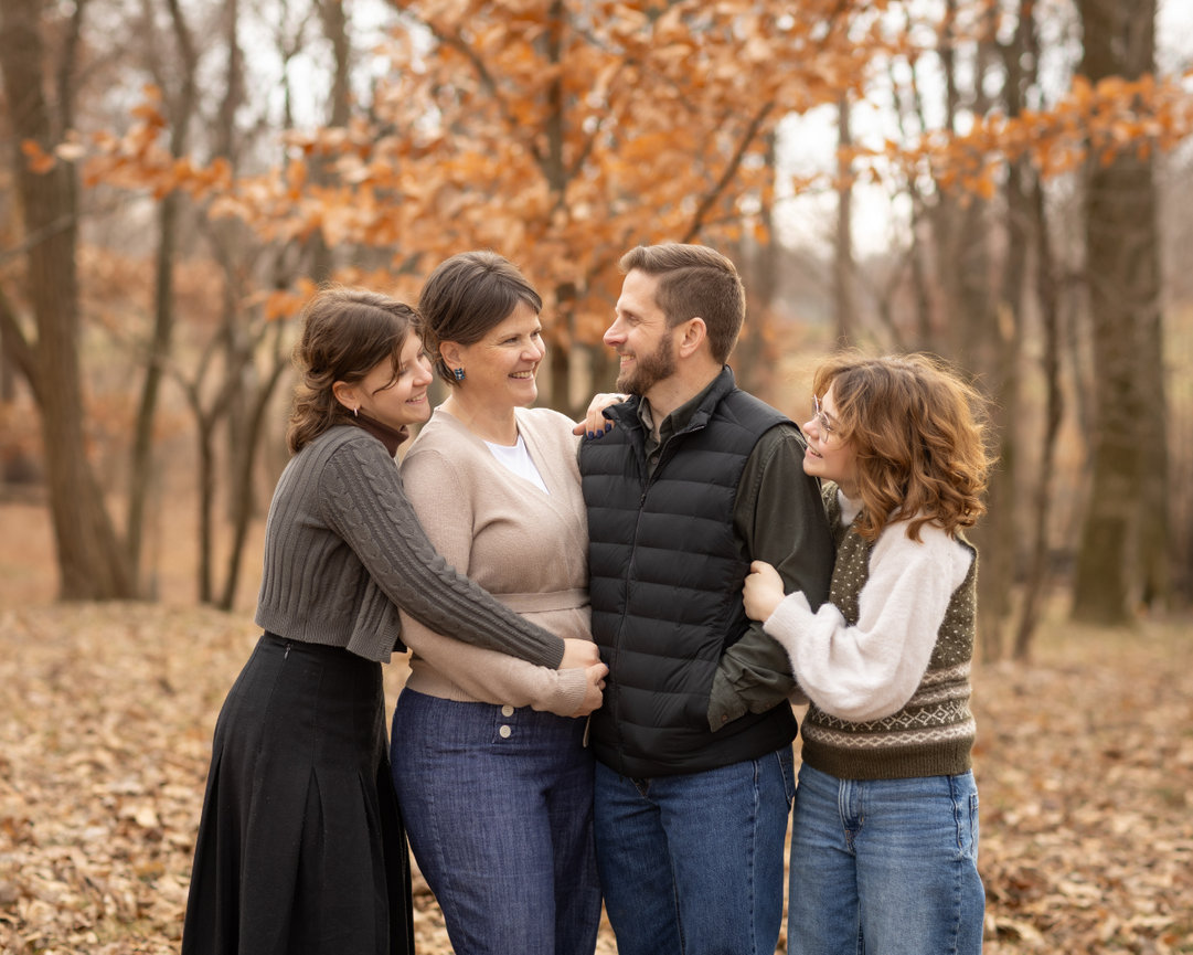 Family in autumn forest