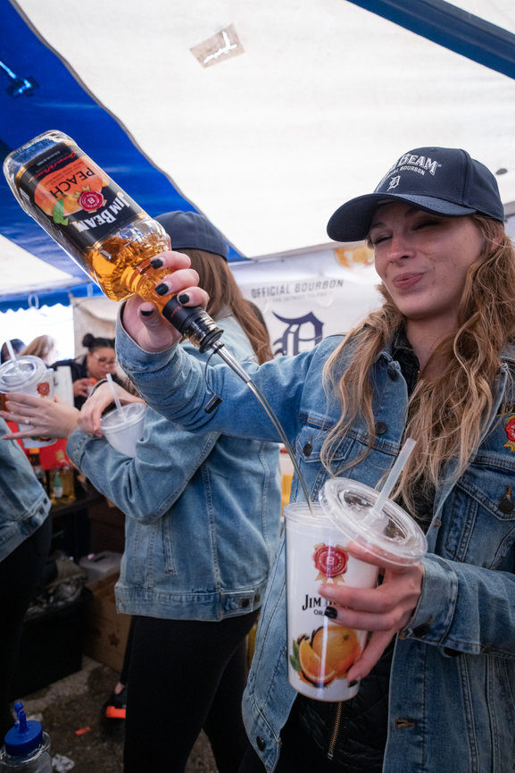 A bartender pouring Jim Beam drinks at Detroit's opening day event 2023