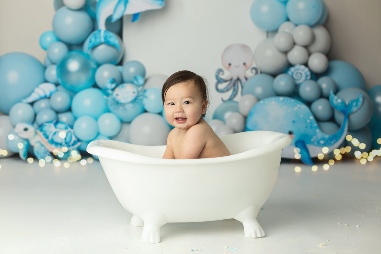 cake smash and splash baby in bathtub