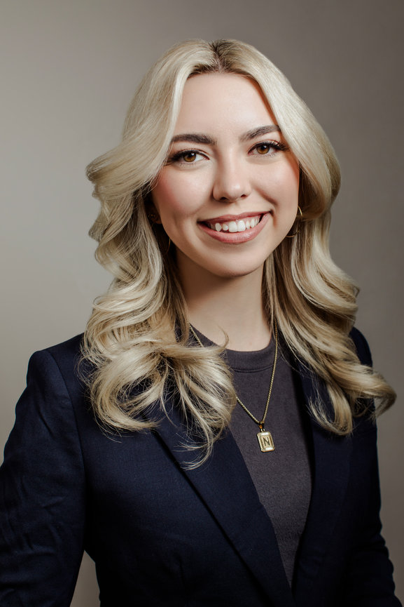 Professional Las Vegas headshots in blue blazer for business woman. Professional headshots and team portraits in studio with Adam Trujillo.