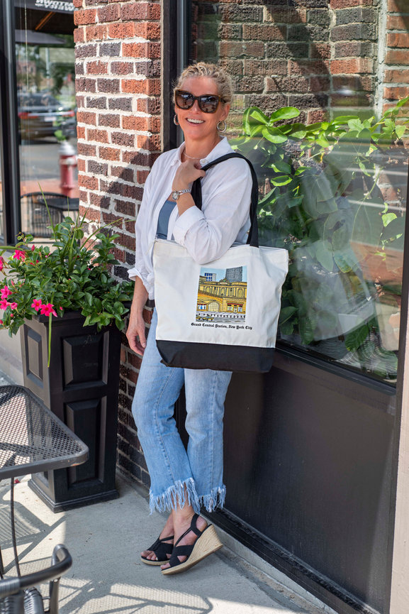 Woman standing with a tote bag
