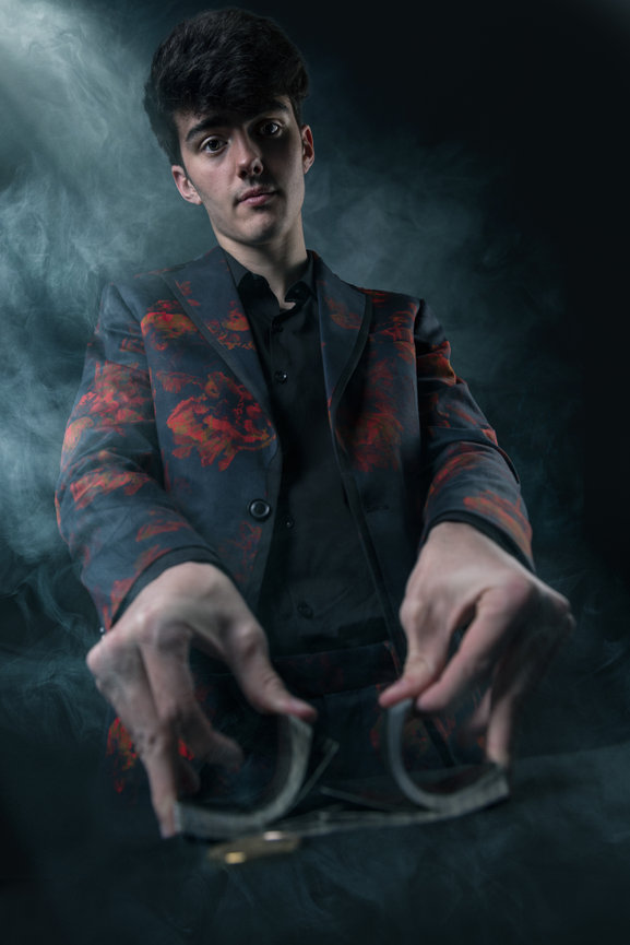 Senior Portrait guy dealing cards smokey poker