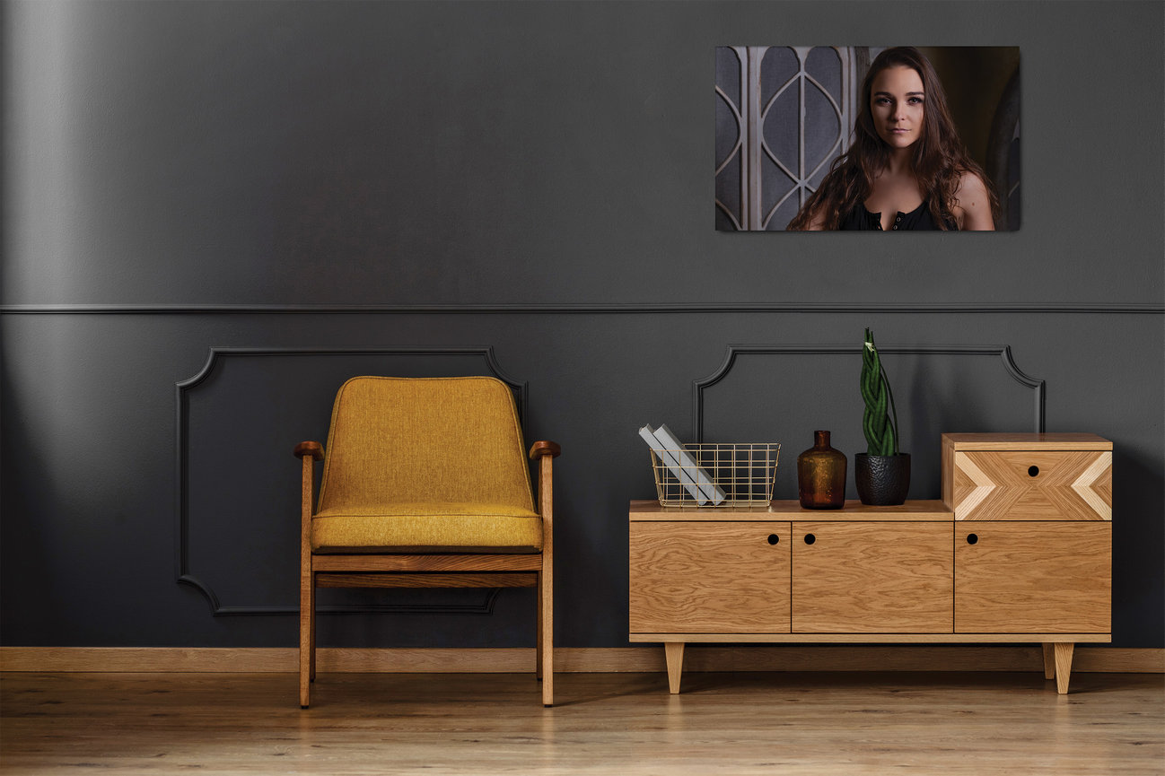 Printed wall art statement piece displayed in a modern interior, featuring a personal portrait of a woman that highlights presence, beauty, and a refined, elegant presentation.