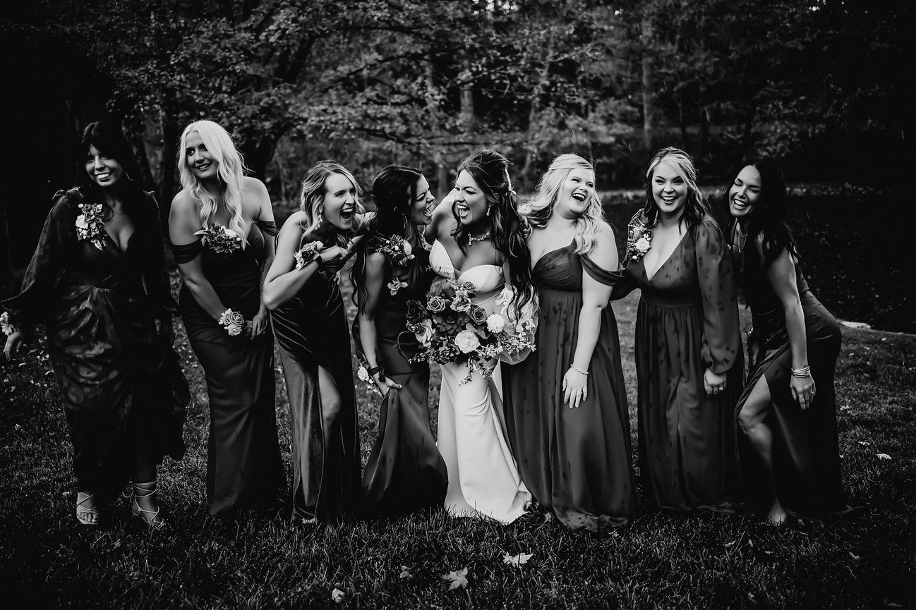 black and white bridal party laughing