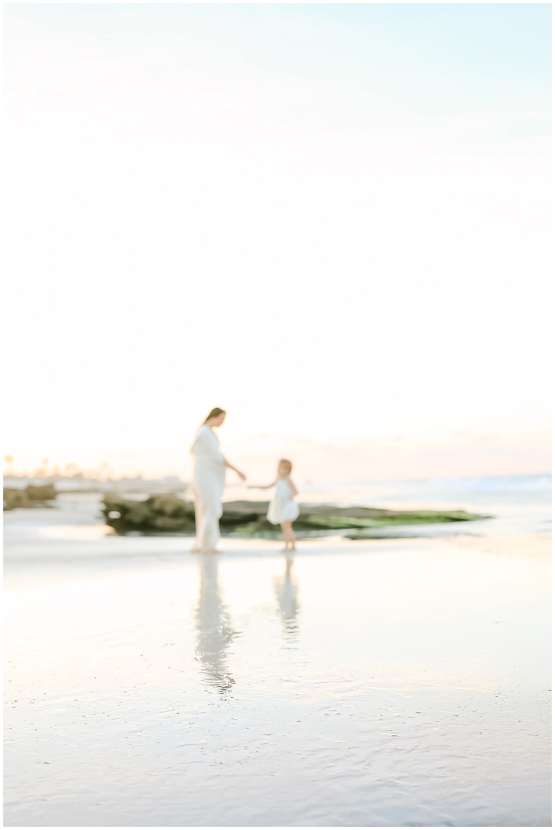 blurry image of a family standing on the coast at sunset in saint augustine florida