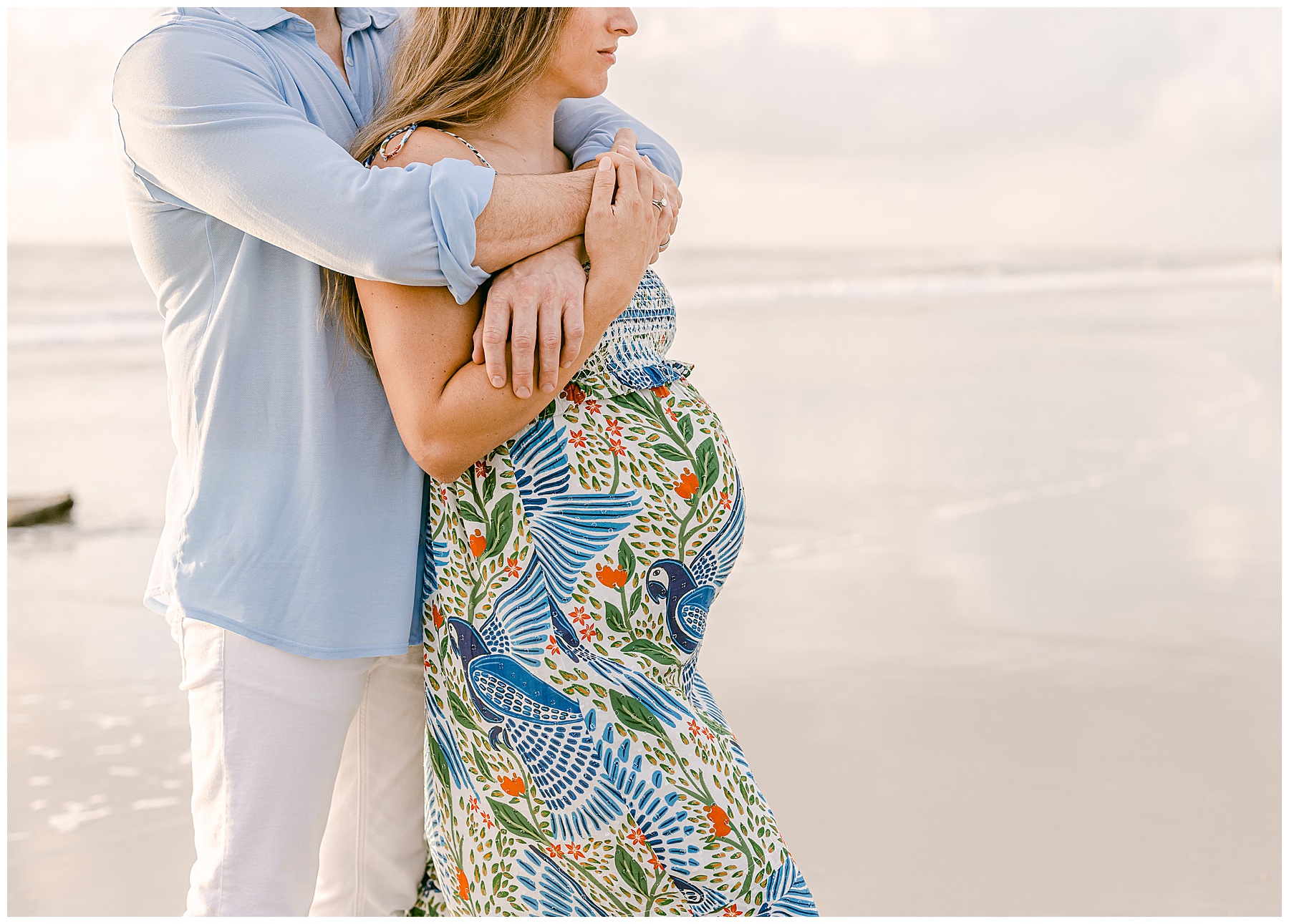 light and airy coastal maternity portrait on the beach at sunrise