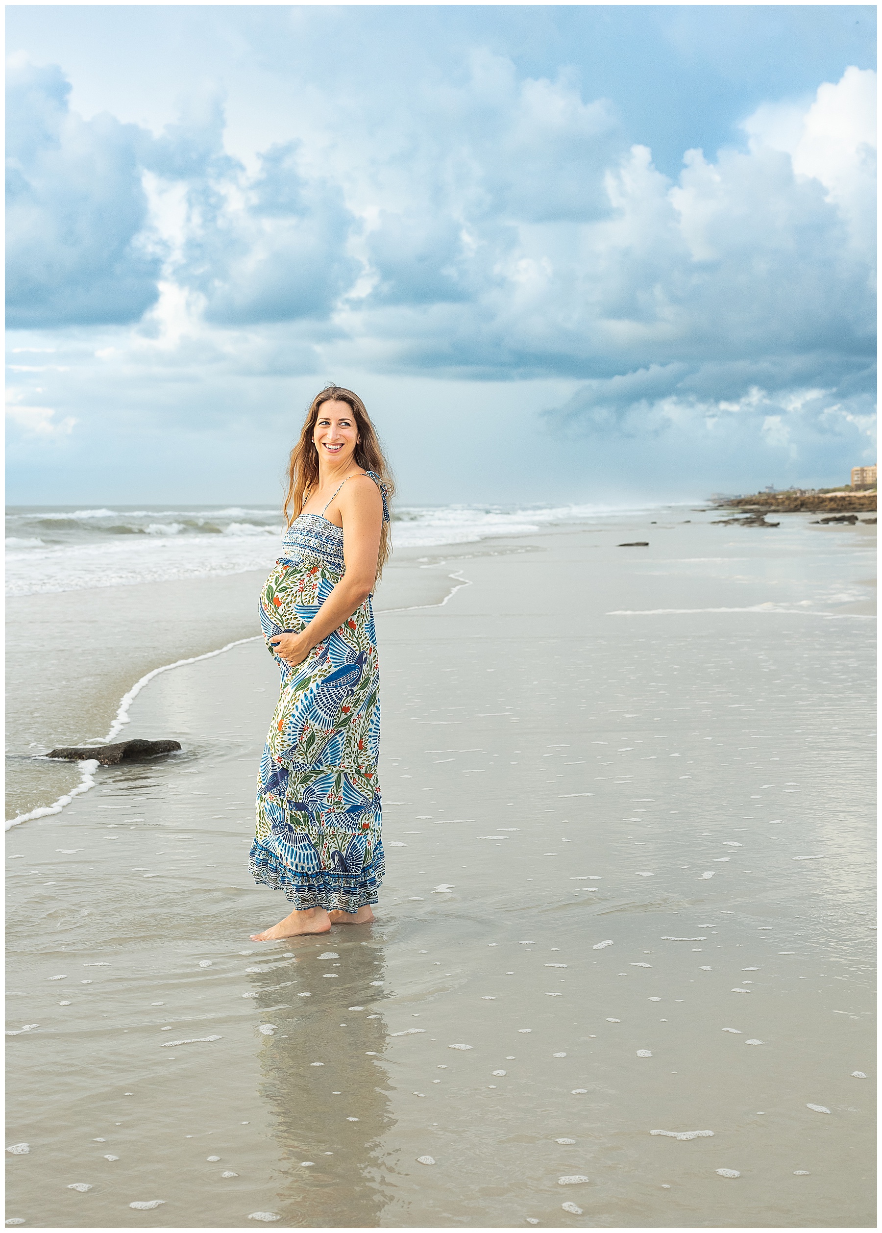 woman walking in the water during a light and airy sunrise on the beach