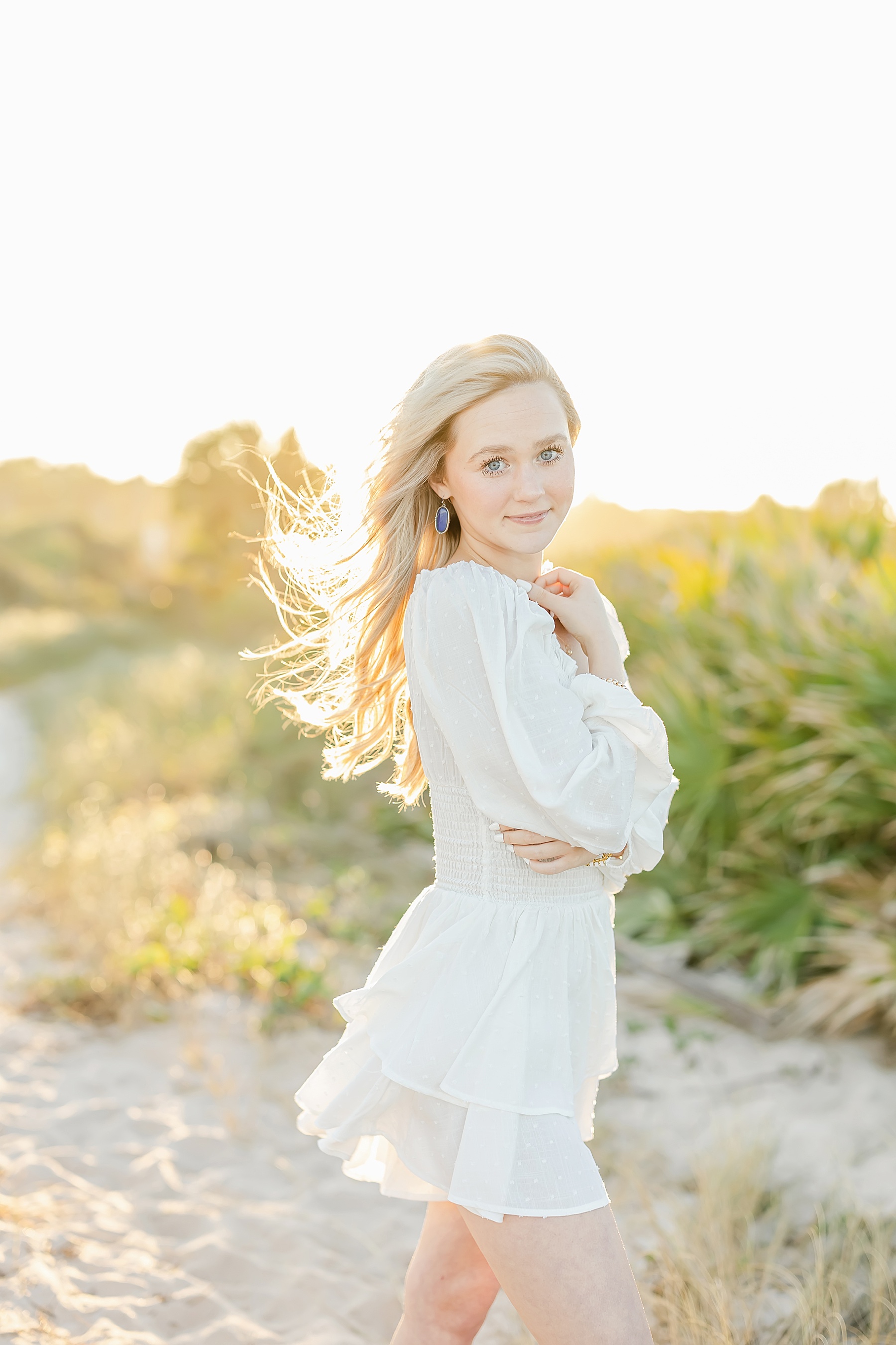 young blond woman portrait at the beach at sunset in Saint Augustine Beach Florida