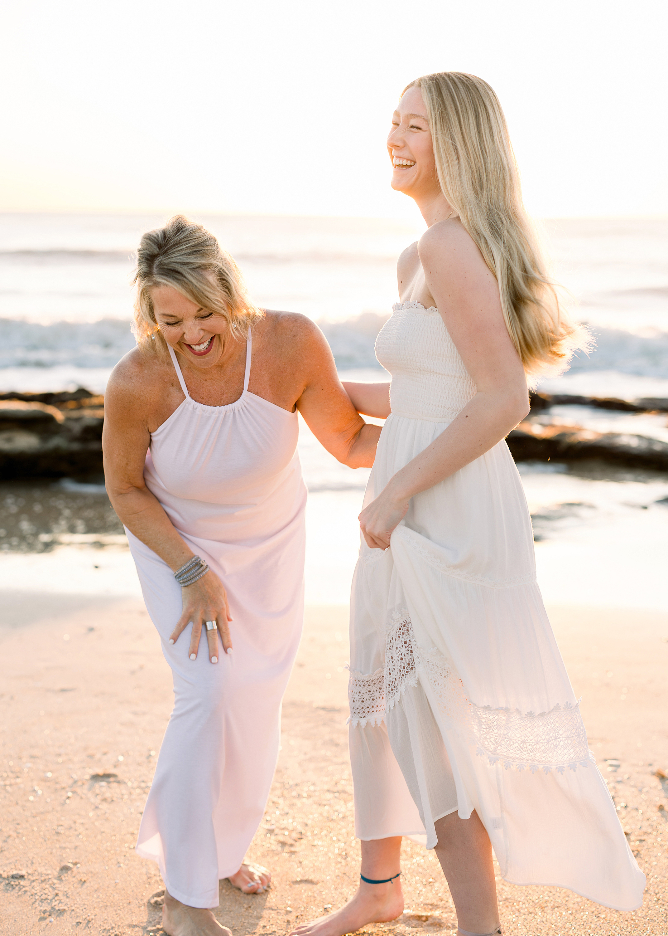 A sunrise portrait of a mother and daughter on the beach in St. Augustine.