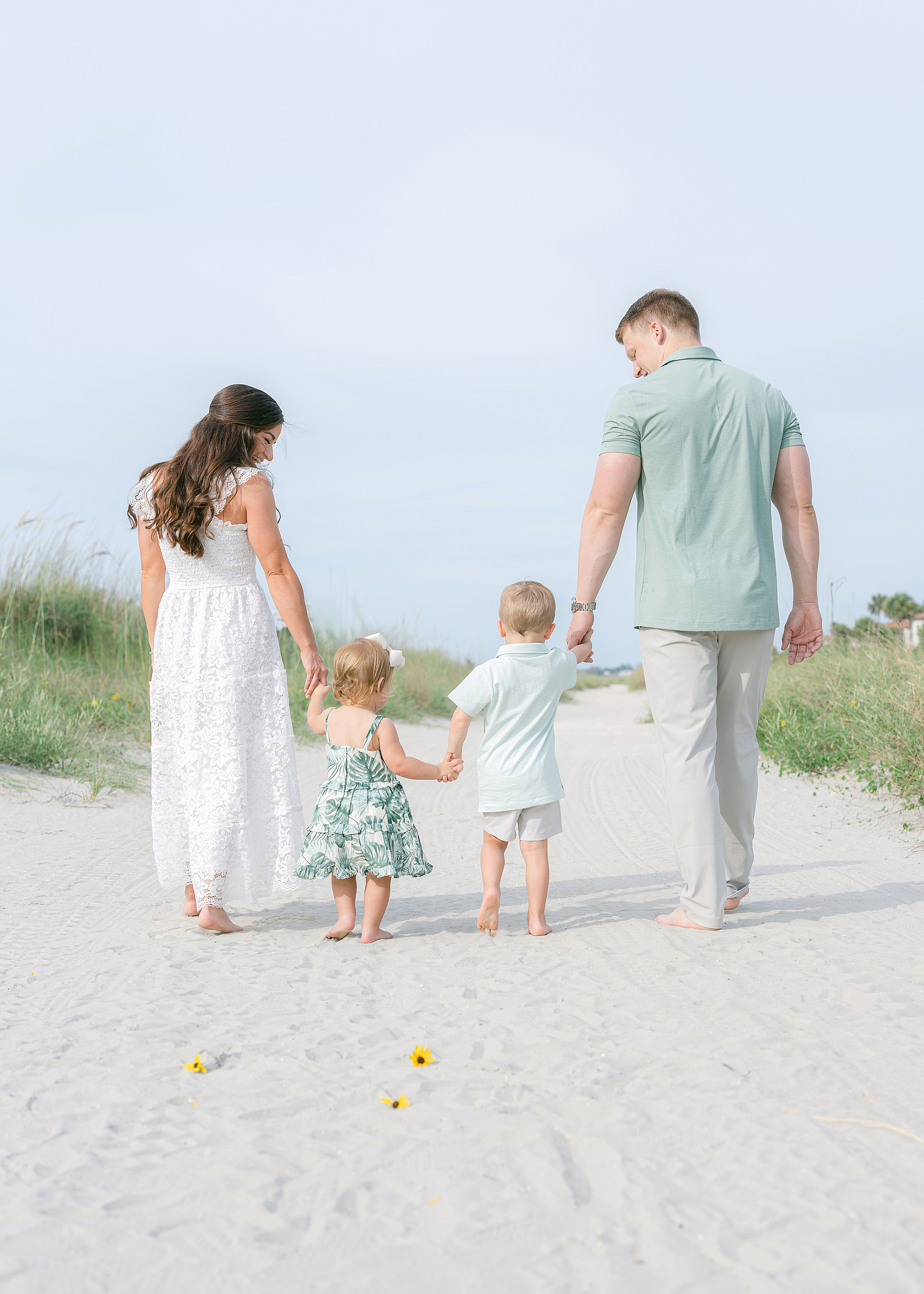 A family beach portrait in the morning at the Beach Club at Sea Island.