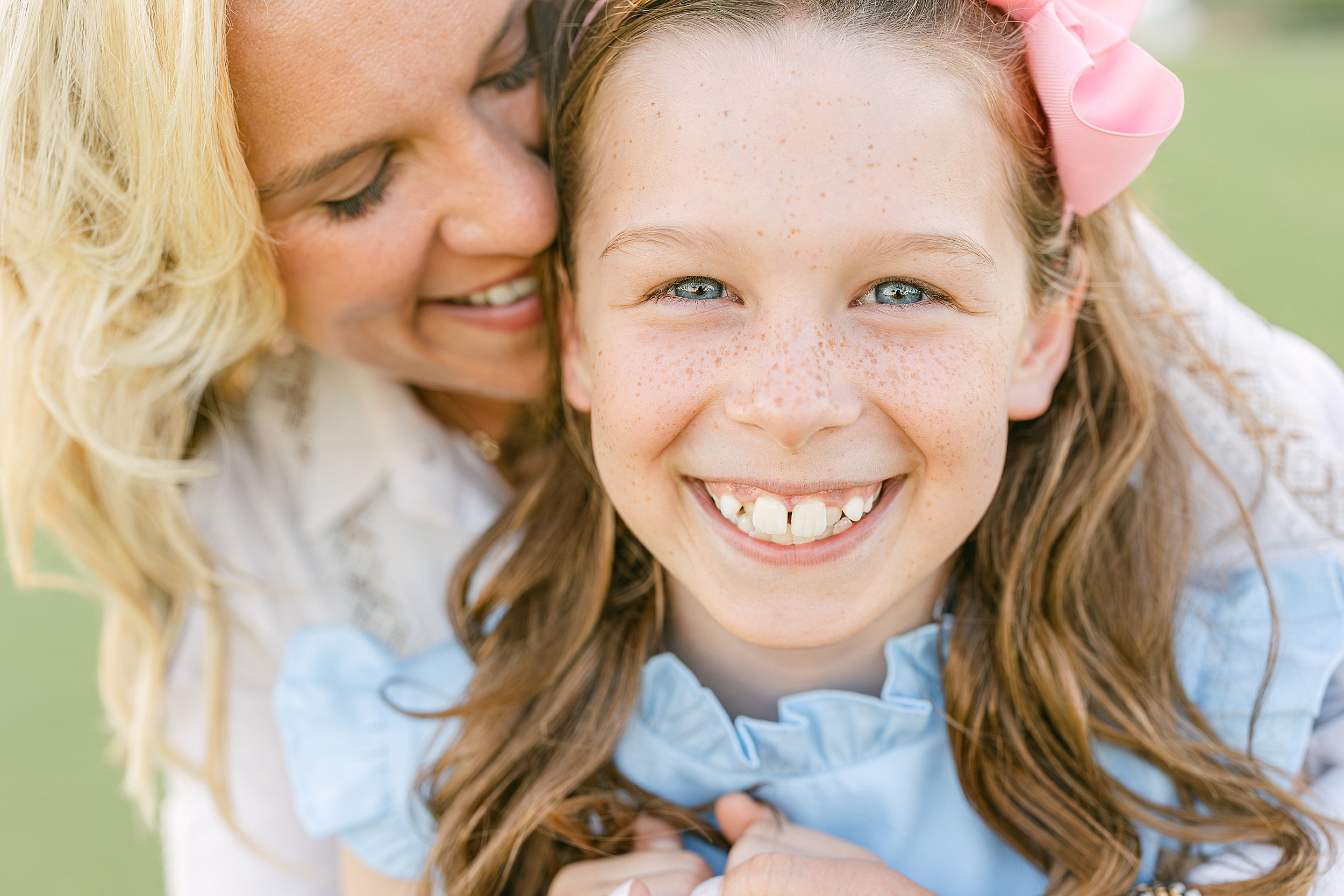 A close up portrait of a mother and daughter at sunset on a golf course in Ponte Vedra Beach, Florida.