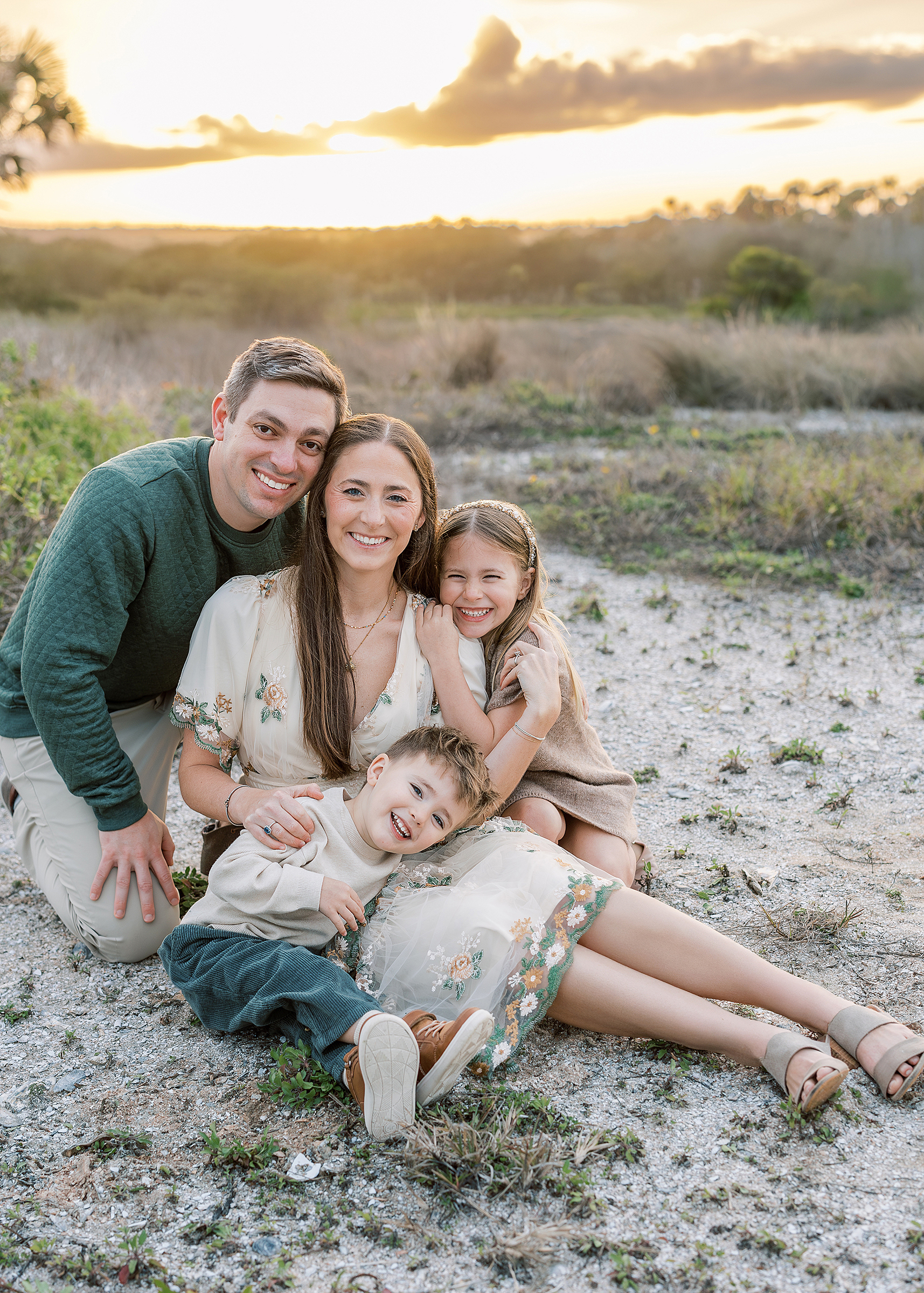 A golden hour family portrait at sunset near St. Augustine Beach, Florida.