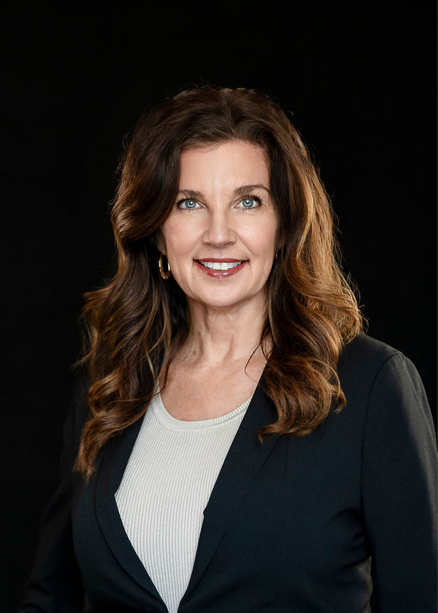Female headshot on black backdrop.
