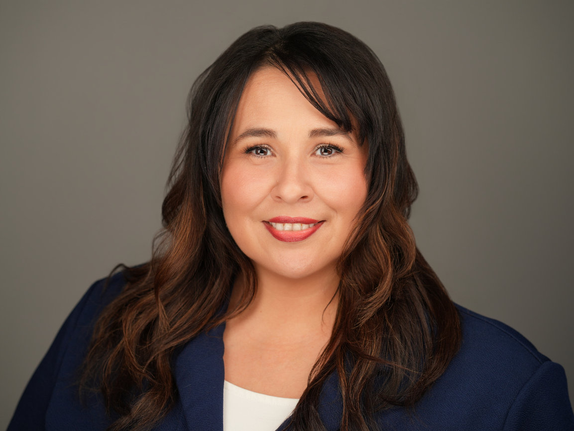Executive-style professional headshot with studio lighting used for LinkedIn and corporate branding