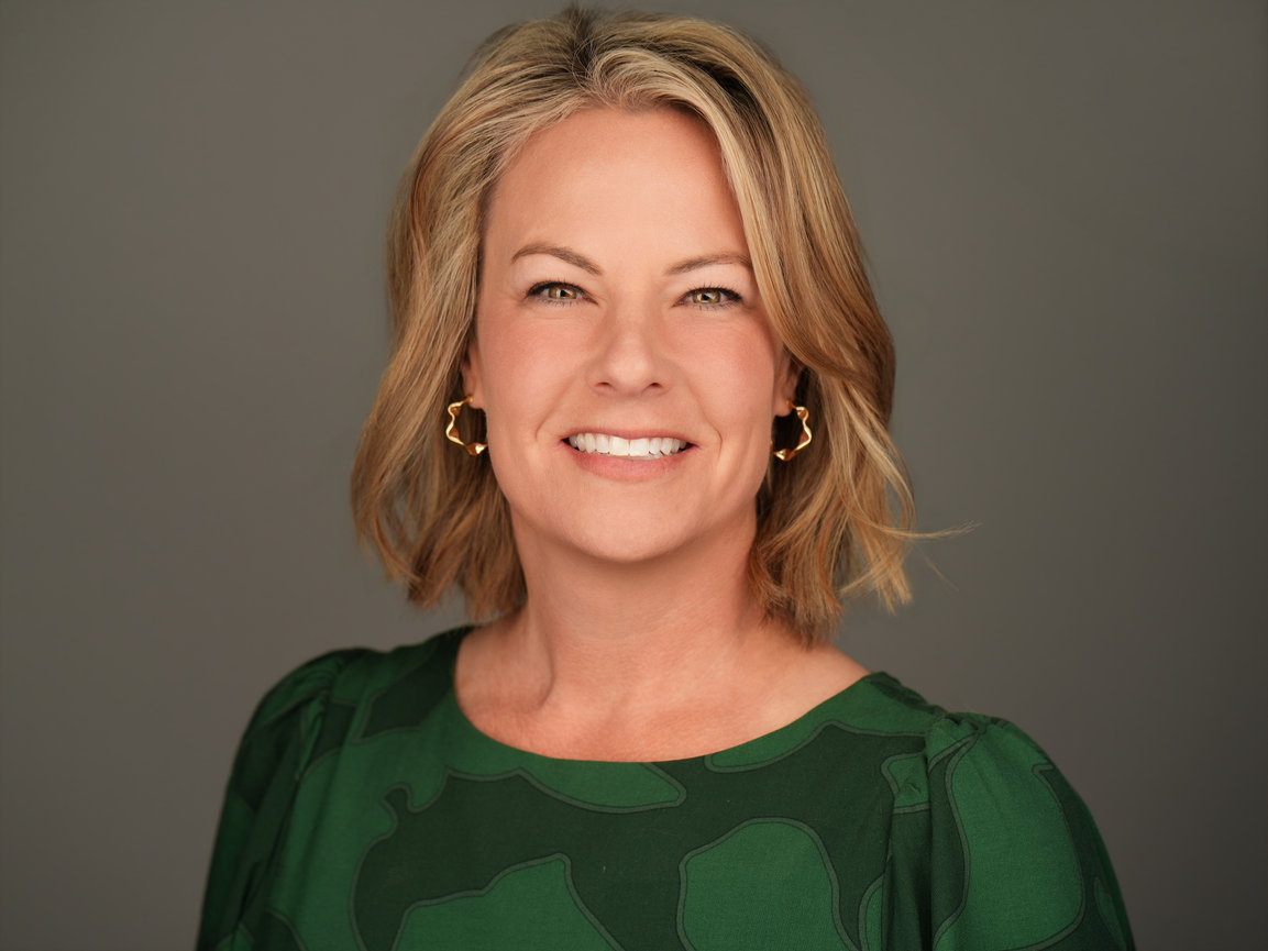 Executive-style professional headshot with studio lighting used for LinkedIn and corporate branding