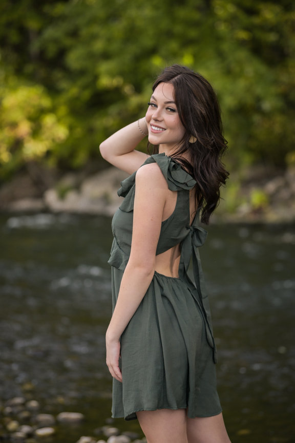 Senior year girl in green dress at the Bosie River, Eagle Idaho