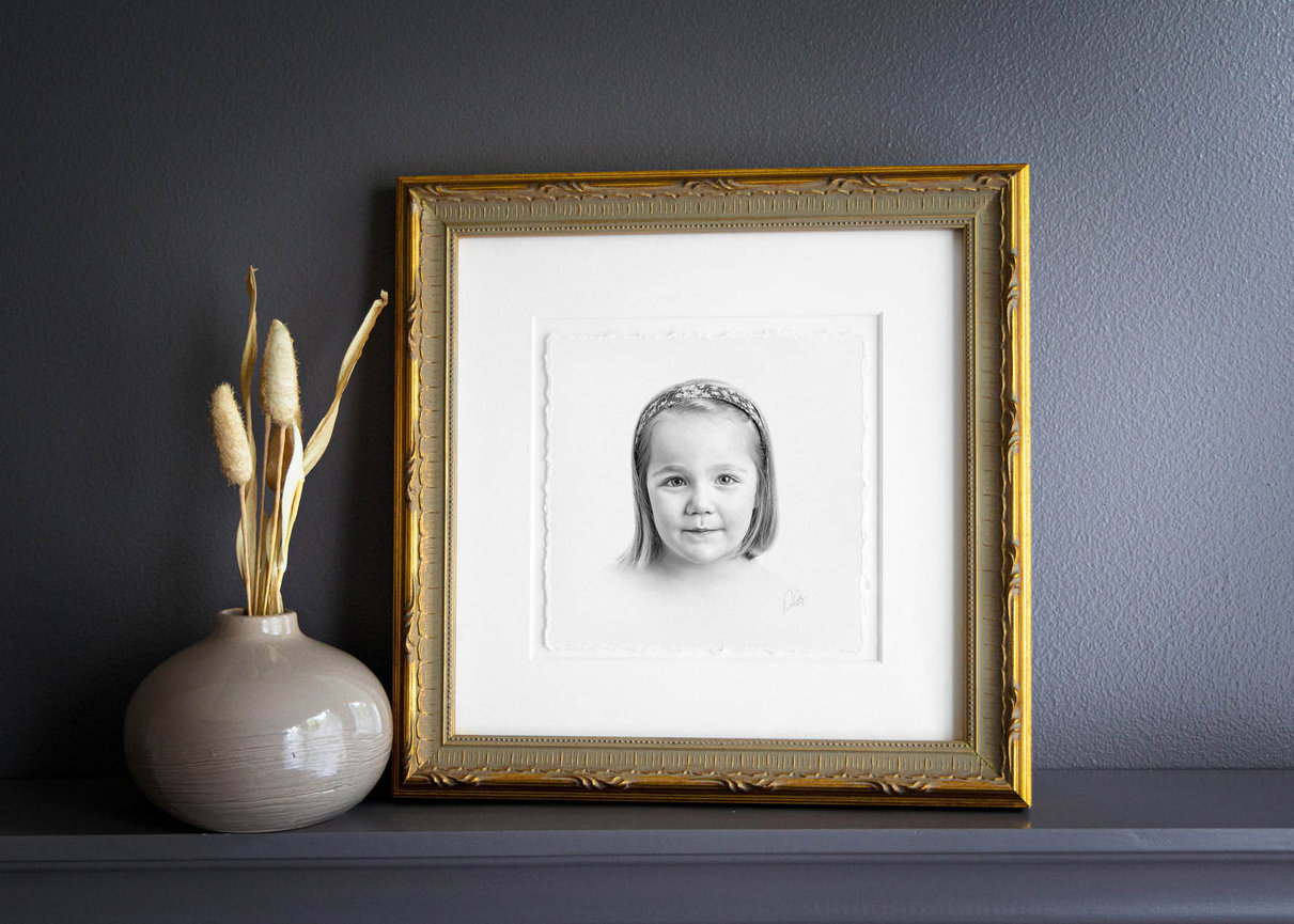 Elegant black and white profile of a child in heirloom-style charcoal, perfect for wall display.
