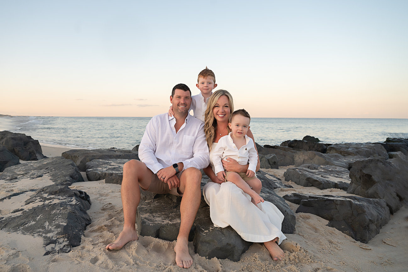 Sunset family portrait with Avon beach in the background