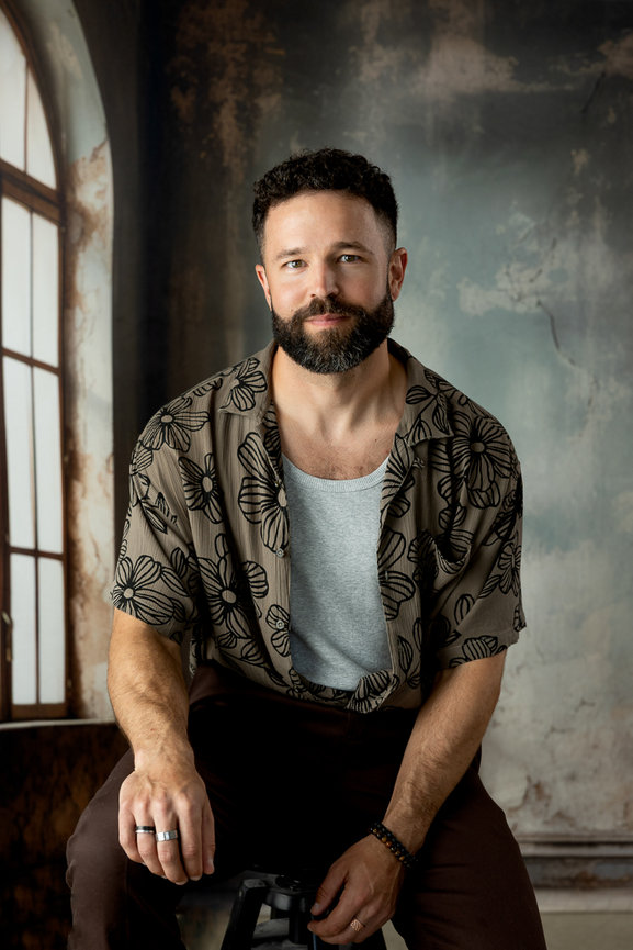 Creative headshot for man in studio against studio backdrop - winnipeg portrait photography