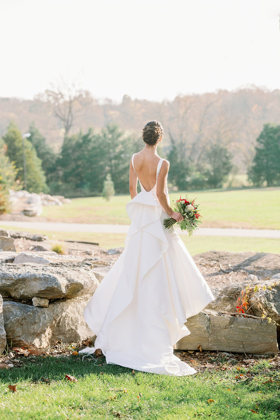 Bridal portrait in Monique Lhuillier gown at golden hour in Franklin, TN. Luxury wedding photography by Heather Durham.
