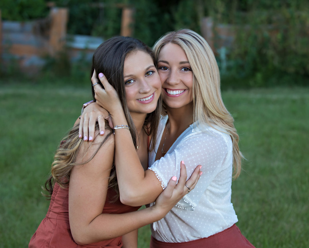 outdoor family portrait of young adult sisters hugging Mansfield ma