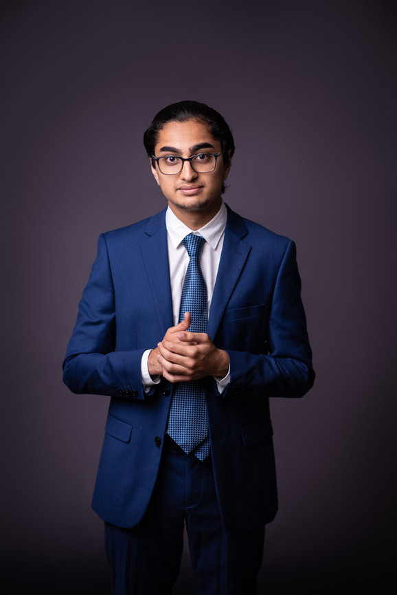 Portrait of a young man in a blue suit