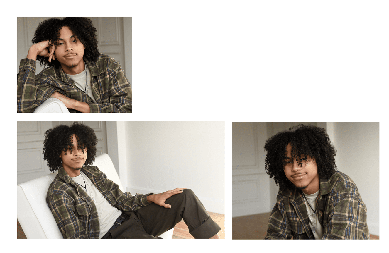 A high school senior guy with dreadlocks and a green plaid shirt.