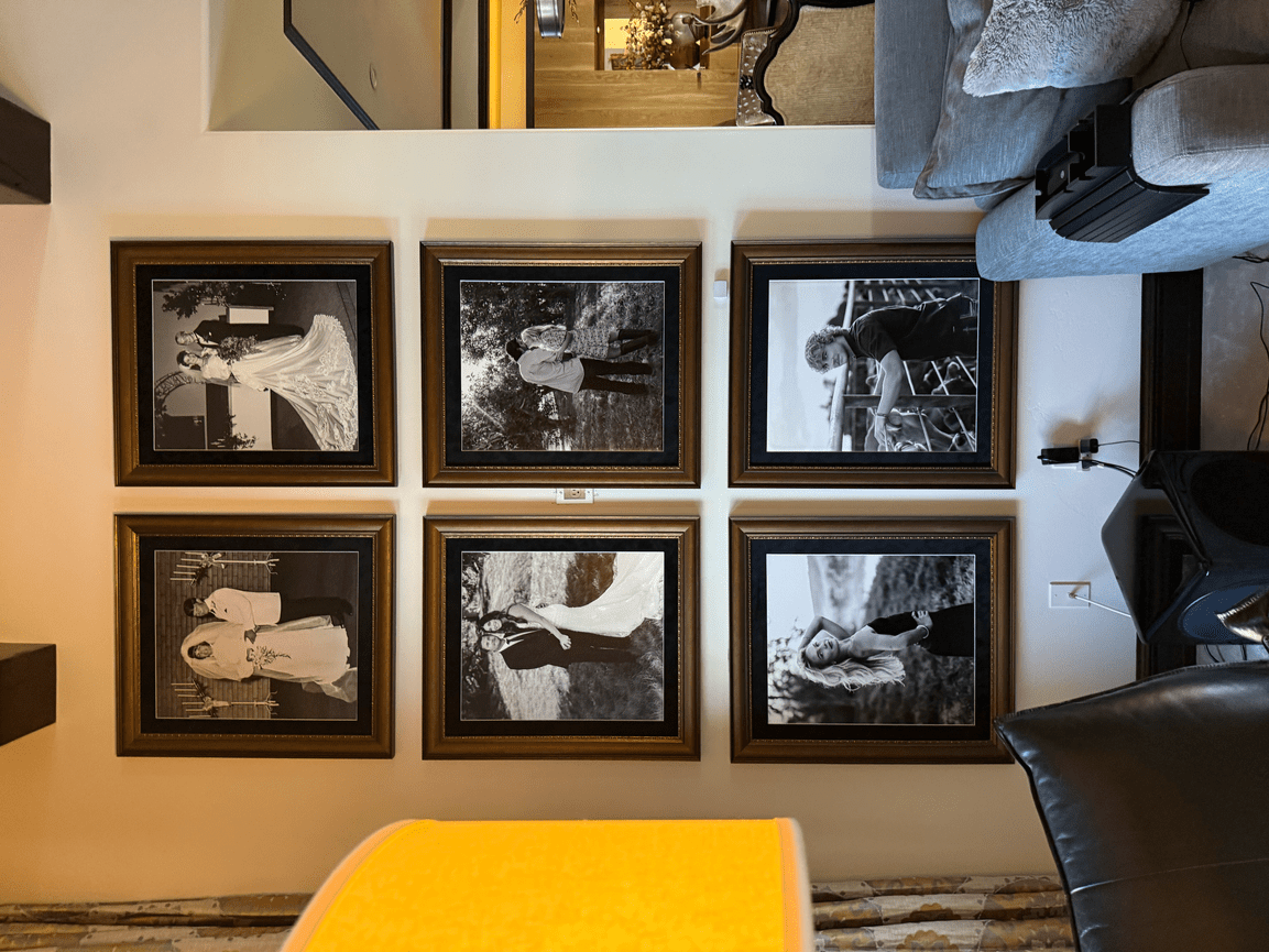 Six framed black-and-white photographs arranged in a neat gallery wall grid