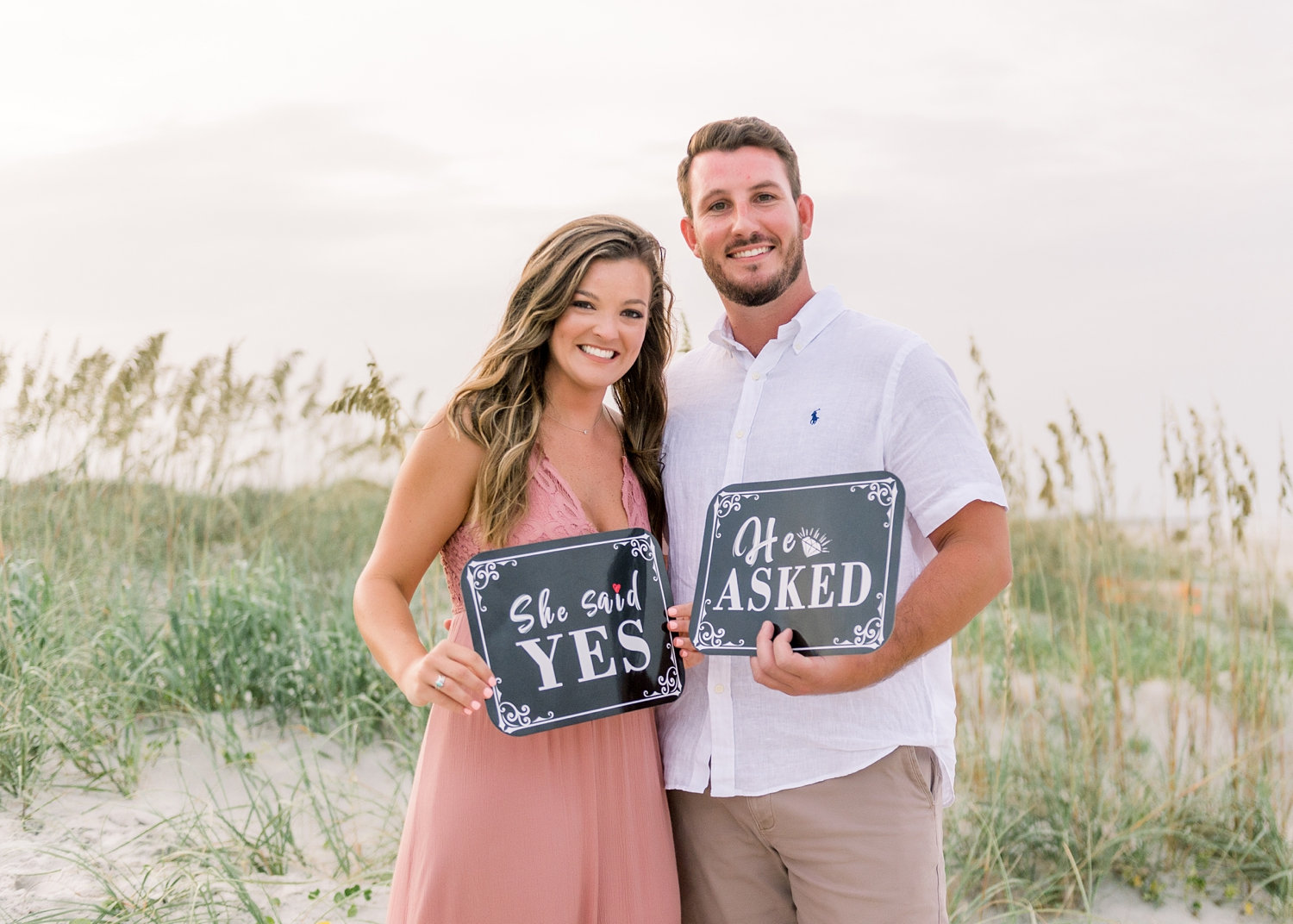 he asked she said yes signs, couple holding engagement signs, Rya Duncklee Photos