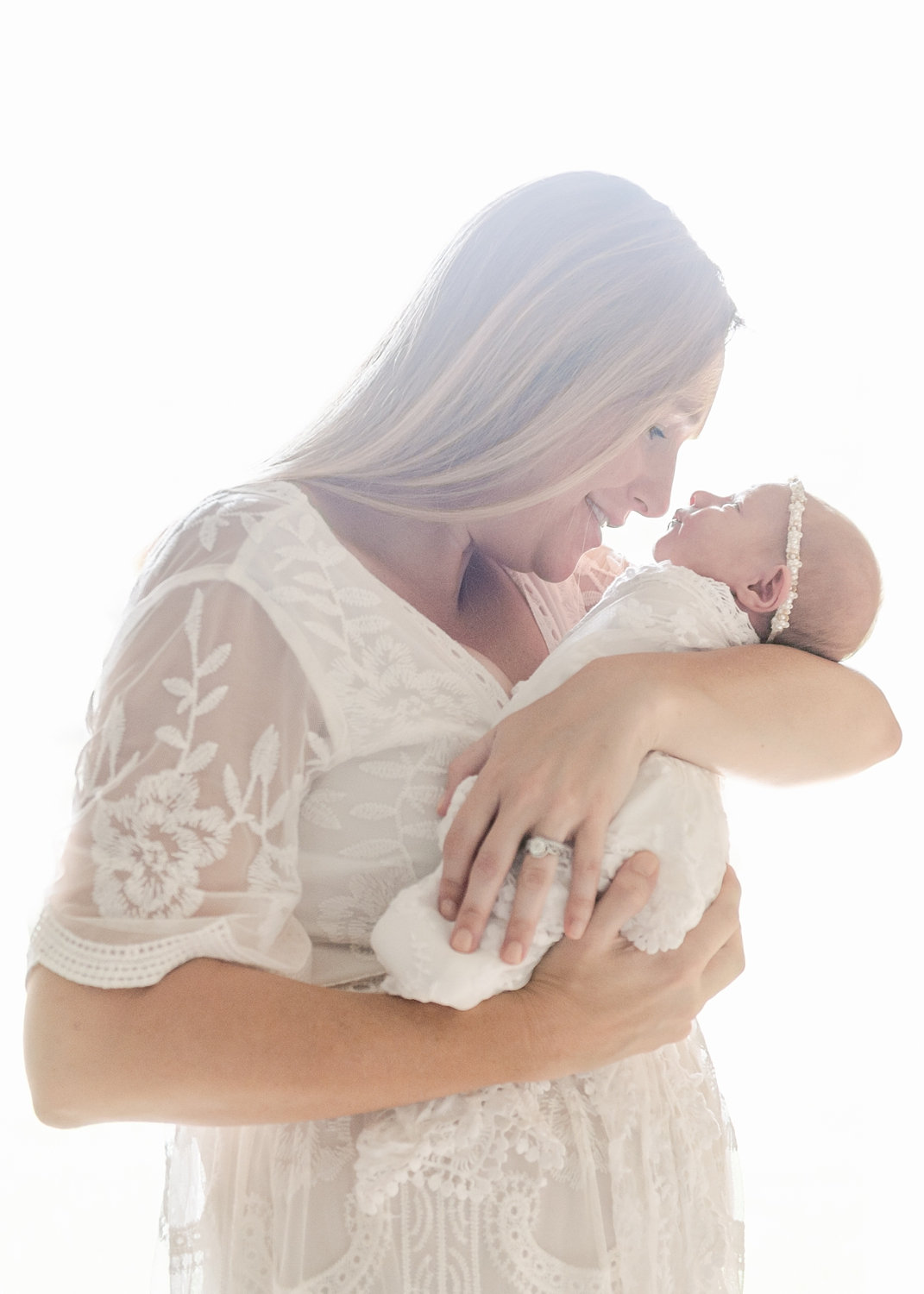 backlit portrait of mother and newborn baby girl, Ryaphotos, Saint Augustine