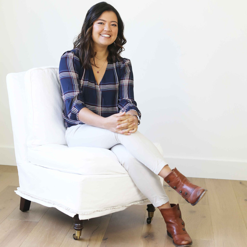 High school senior girl in a modern in-home portrait session, seated gracefully in natural light. Captured to showcase her personality, style, and timeless elegance. Luxury senior portrait experience for Colorado families
