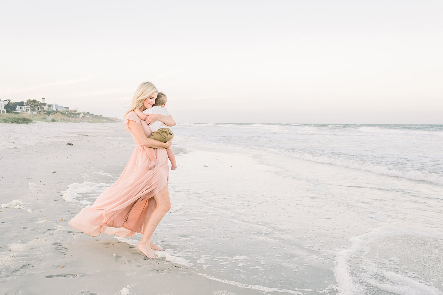 mother embracing toddler son on the beach, Ponte Vedra Beach, Florida, Ryaphotos